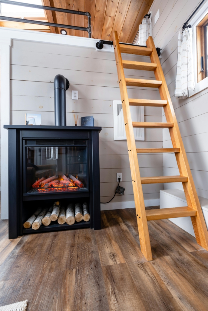Electric Fireplace in a small home near a ladder